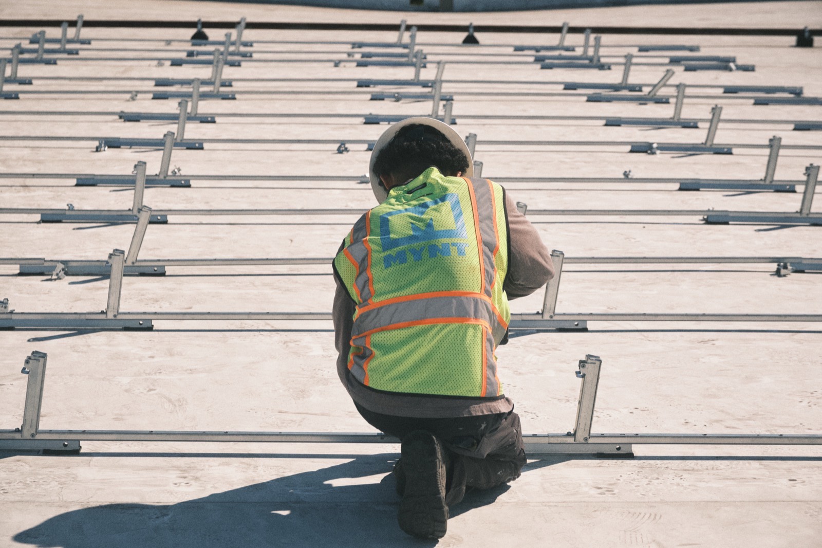 MYNT crew member on site during a solar build